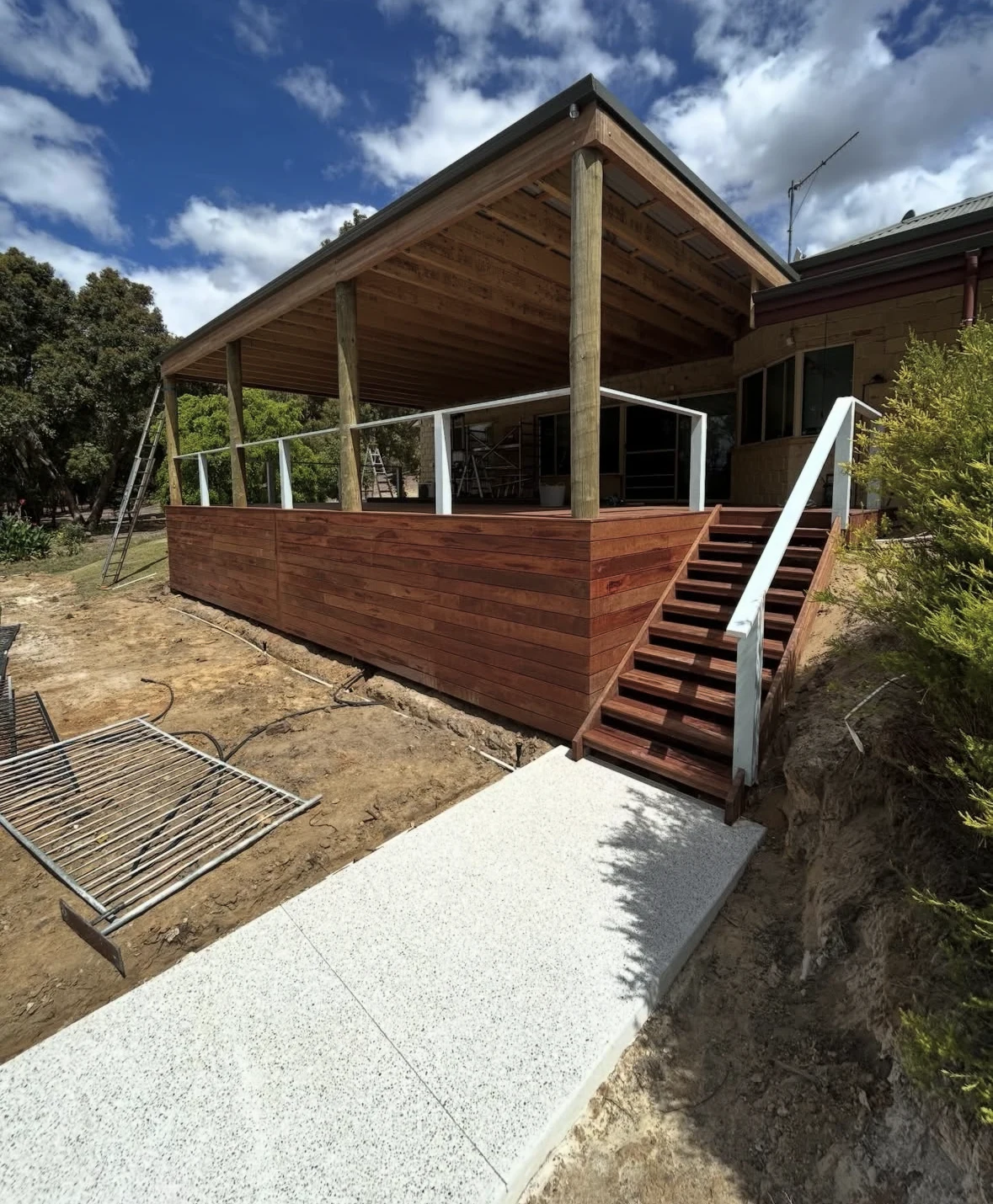 Merbau deck, outdoor timber roof structure and stairs at a Donnybrook home