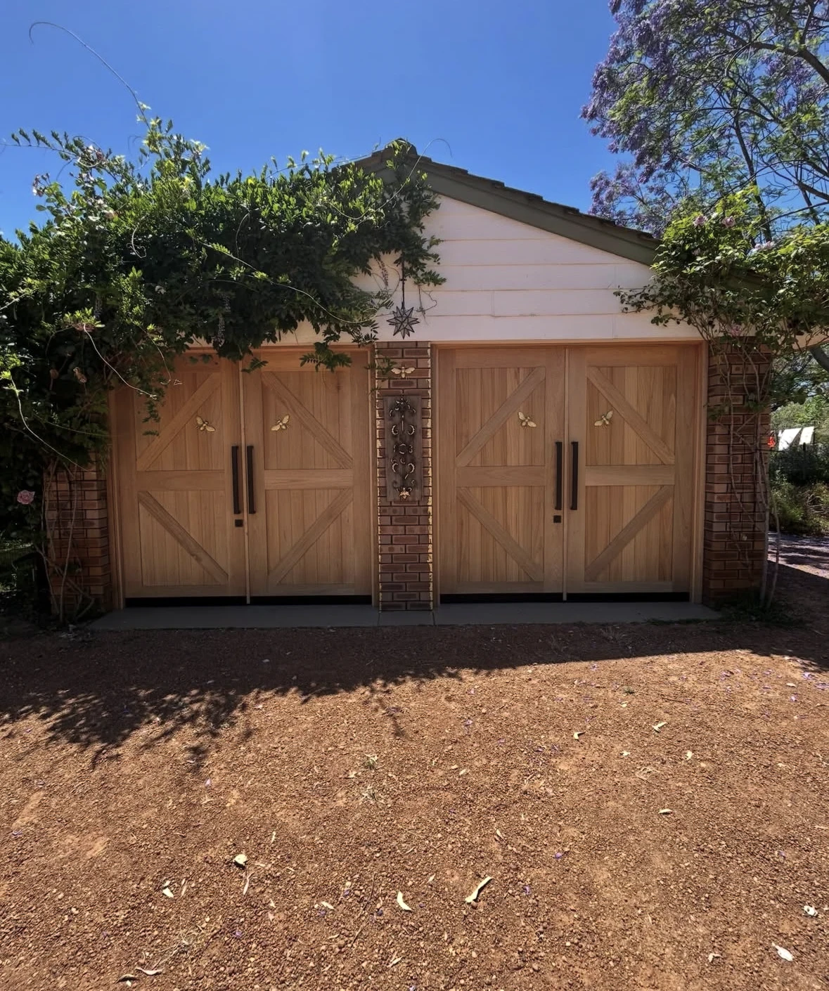 Finished custom maranti garage doors in Stratham